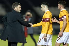 An equaliser by Tony Watt (centre) earned a point for Motherwell at St Johnstone (Library pic)
