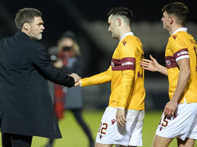 An equaliser by Tony Watt (centre) earned a point for Motherwell at St Johnstone (Library pic)