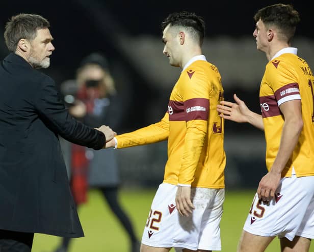 An equaliser by Tony Watt (centre) earned a point for Motherwell at St Johnstone (Library pic)