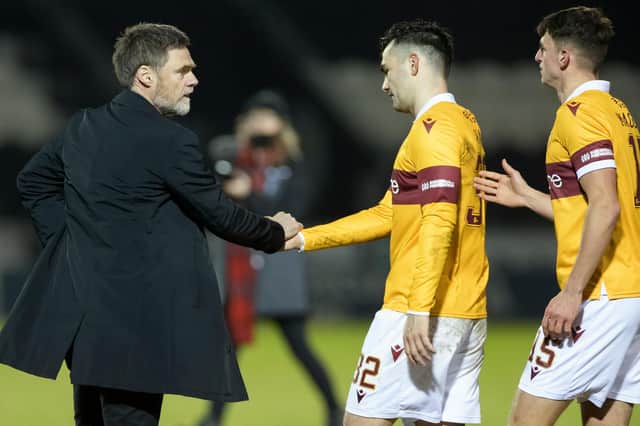 An equaliser by Tony Watt (centre) earned a point for Motherwell at St Johnstone (Library pic)