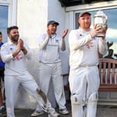 Uddingston were champions just three years ago (Bryan Clarke is pictured holding league trophy) but are currently bottom of table this time around (Pic by David Potter)