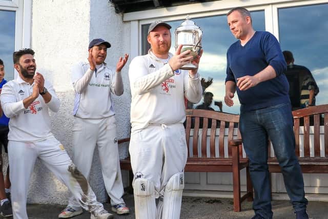Uddingston were champions just three years ago (Bryan Clarke is pictured holding league trophy) but are currently bottom of table this time around (Pic by David Potter)
