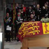 King Charles III and members of his family look on as the Duke of Hamilton places the Crown of Scotland on Queen Elizabeth II's coffin. Picture: Aaron Chown/WPA Pool/Getty