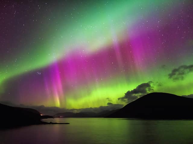 Aurora Borealis, also known as the Northern Lights, putting a show on dancing over Loch Glascarnoch, by Garve, in the Highlands