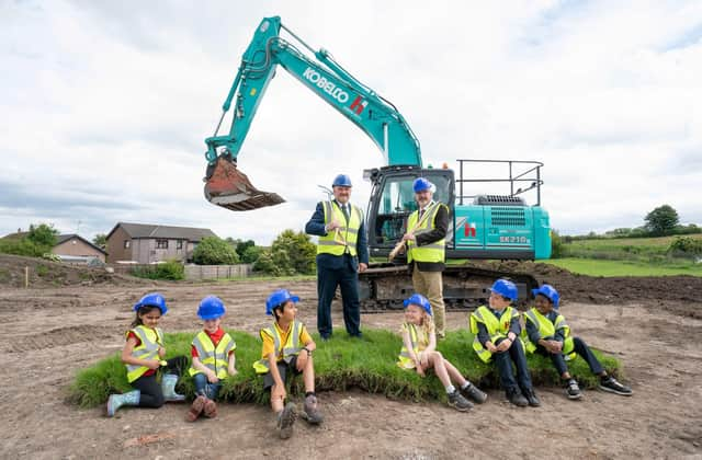 East Renfrewshire Council leader Owen O'Donnell and Councillor Tony Buchanan with pupils from Neilston Primary, St Thomas' Primary and Madras Family Centre