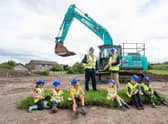 East Renfrewshire Council leader Owen O'Donnell and Councillor Tony Buchanan with pupils from Neilston Primary, St Thomas' Primary and Madras Family Centre