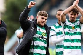 James Forrest takes the acclaim of the Celtic fans after his match-winning double against Dundee at Dens Park.  (Photo by Ross Parker / SNS Group)