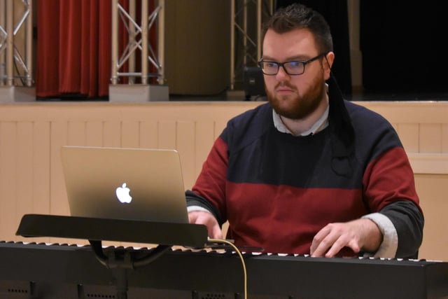 A study of concentration, musical director Jack Thomson focuses on the task at hand.
