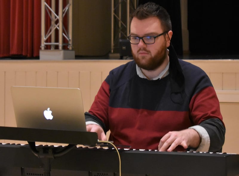 A study of concentration, musical director Jack Thomson focuses on the task at hand.