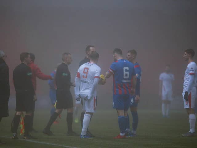 Referee Barry Cook explains his decision to Clyde skipper David Goodwillie and Airdrie captain Callum Fordyce (pic: Craig Black Photography)