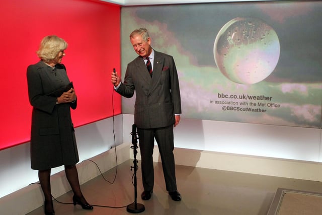 Prince Charles and Camilla read the weather in the Six O'Clock studio during a tour of  the BBC Scotland HQ.