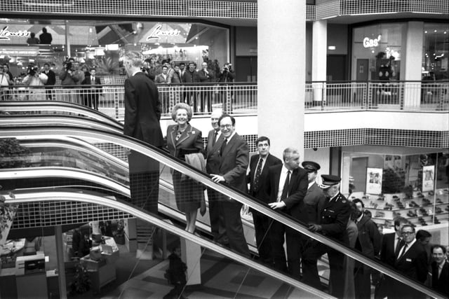 Mrs Thatcher and Scottish Secretary Malcolm Rifkind take a ride on one of the escalators.