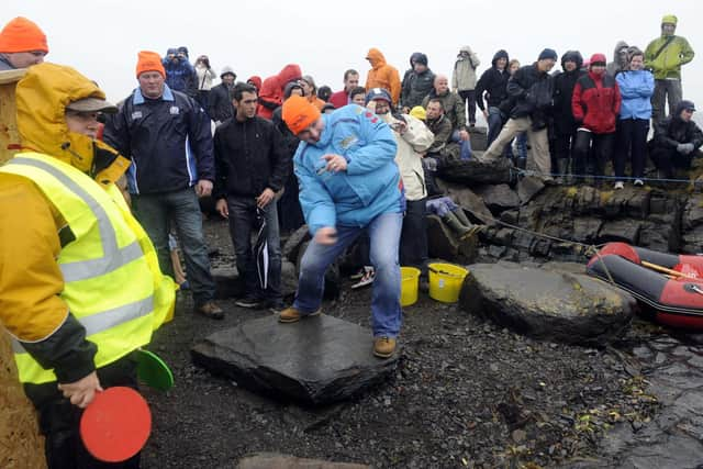 It's all in the swing: 2009 event sponsor John Forteith, from Oban, shows how to skim the perfect stone
Pic: Jane Barlow