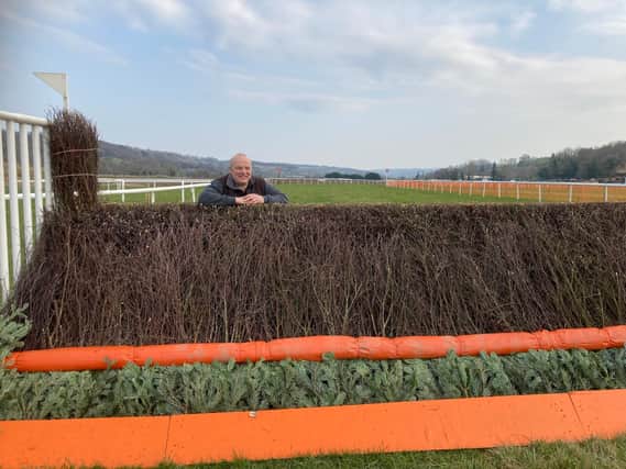 Clerk of the course Willie Young Jnr gets a close up view of an Overton Farm fence
