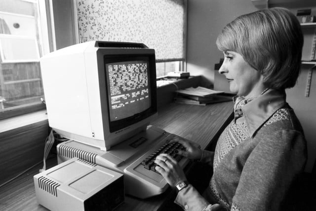 A woman using the new Apple II computer at the Royal Infirmary Glasgow, May 1979.