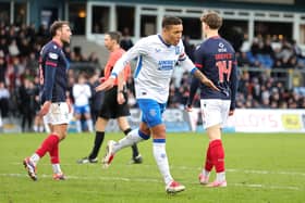 Rangers' James Tavernier (left) celebrates scoring his side's third goal in a 3-0 win away at Ross County