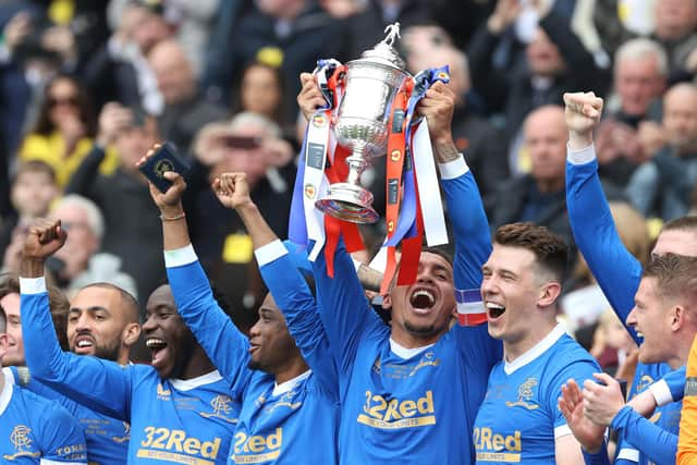 Rangers' James Tavernier lifts the Scottish Cup after the final whistle of the Scottish Cup final at Hampden Park, Glasgow. Picture date: Saturday May 21, 2022.