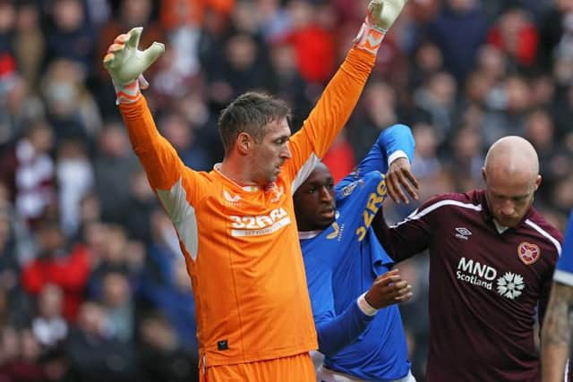 Hearts striker Liam Boyce (right) in a tussle with Rangers goalkeeper Allan McGregor (left) and midfielder Glen Kamara during the Premiership match at Tynecastle on Sunday.(Photo by Craig Williamson / SNS Group)