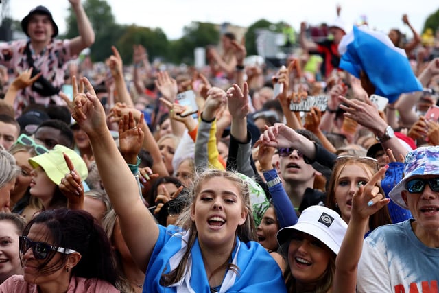 Festival goers watch Ella Henderson perform on the main stage.