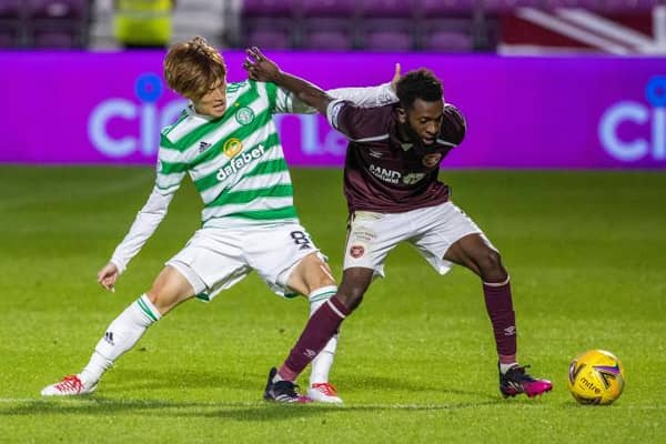 Celtic's new signing Kyogo Furuhashi (left) makes his debut as he competes with Hearts' debutant Beni Baningime during the cinch Premiership match between Hearts and Celtic at Tynecastle, on July 31, 2021. (Photo by Alan / SNS Group)