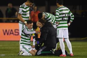 Celtic's  players show concern for Callum McGregor following the facial injury that has raised concerns of an extended period on the sidelines for the player. (Photo by Craig Foy / SNS Group)