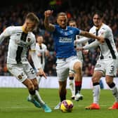 Rangers' Kemar Roofe (centre) tries to find a way through the Livingston defence.