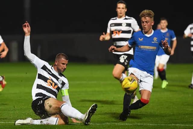 Rangers' Ross McCausland (right) competes with Sean McGinty during the SPFL Trust Trophy match between Rangers B and Ayr United at the C&G Systems Stadium on September 14, 2021, in Dumbarton, Scotland. (Photo by Craig Foy / SNS Group)