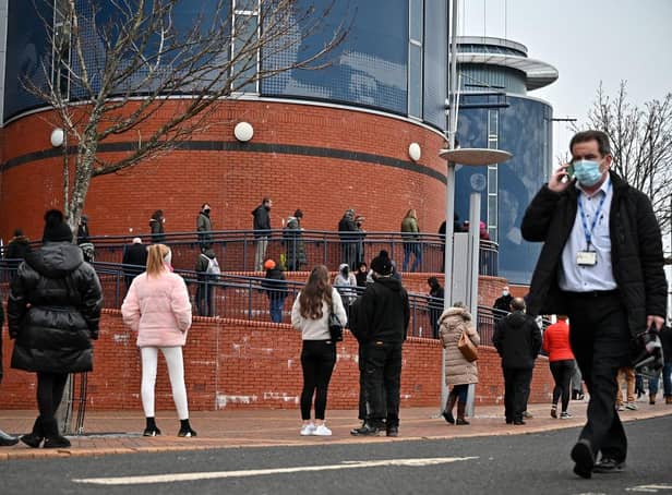 <p>Members of the public queue to receive a Covid-19 vaccine outside Hampden Park. Picture: Jeff J Mitchell/Getty Images</p>