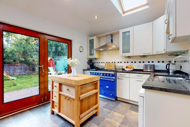 The kitchen looks out over the back garden.