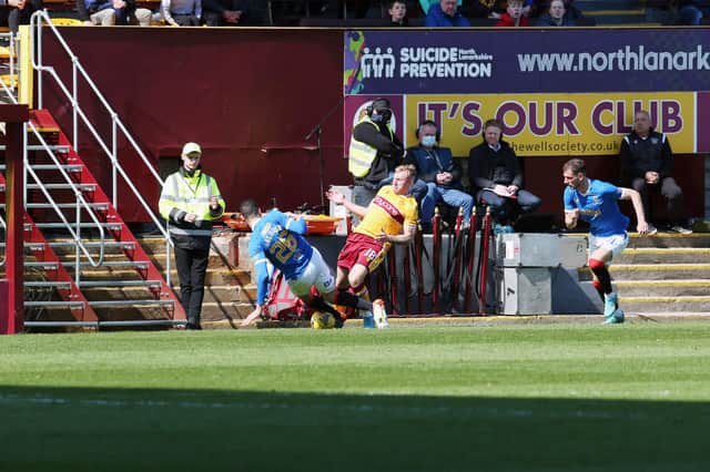Leon Balogun lunges in on Dean Cornelius to earn a straight red card (Pics by Ian McFadyen)