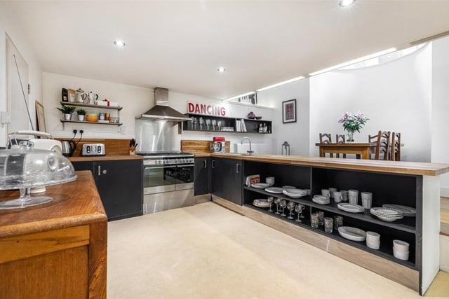 The modern kitchen includes the butchers block worktop.