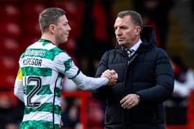 Celtic's Callum McGregor shakes hands with Brendan Rodgers