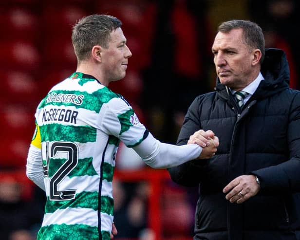 Celtic's Callum McGregor shakes hands with Brendan Rodgers