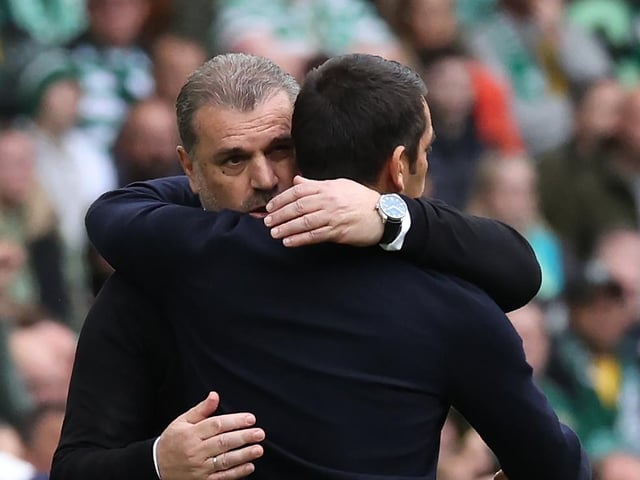Rangers manager Giovanni van Bronckhorst and Celtic manager Ange Postecoglou embrace after the game.