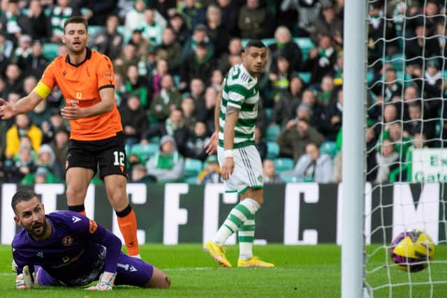 Dundee United goalkeeper Mark Birighitti can only watch as Sead Haksabanovic's shot creeps over the line in the 4-2 defeat to Celtic.  (Photo by Craig Foy / SNS Group)