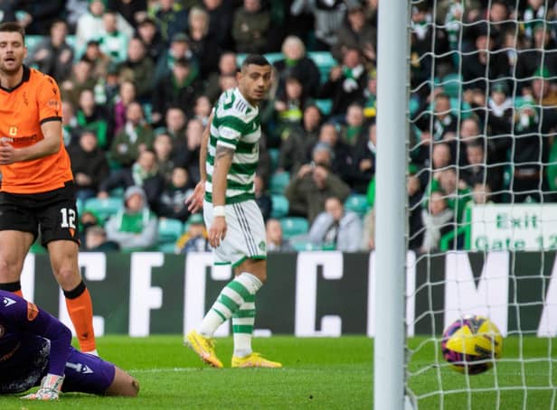 <p>Dundee United goalkeeper Mark Birighitti can only watch as Sead Haksabanovic's shot creeps over the line in the 4-2 defeat to Celtic.  (Photo by Craig Foy / SNS Group)</p>