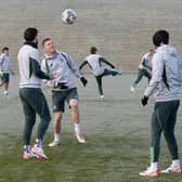 Callum McGregor and Mikey Johnston prepare in freezing conditions for Celtic's match against St Johnstone.