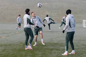 Callum McGregor and Mikey Johnston prepare in freezing conditions for Celtic's match against St Johnstone.