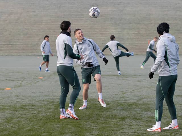Callum McGregor and Mikey Johnston prepare in freezing conditions for Celtic's match against St Johnstone.