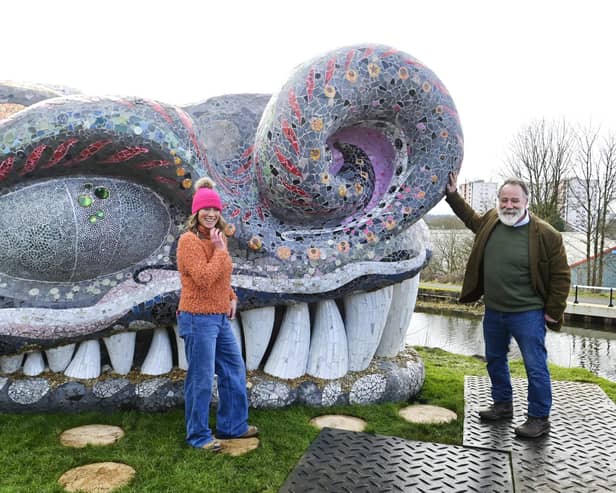 Artists Ruth Impey and Nichol Wheatley beside the completed head of Bella The Beithir which they created, at its unveiling on March 1 beside Stockingfield Bridge on the Forth & Clyde Canal in Glasgow. (Photo by John Devlin/The Scotsman)