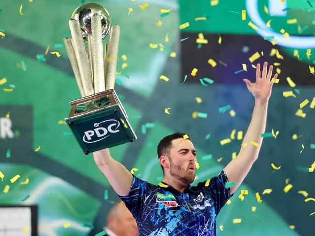 TROPHY PARADE - Luke Humphries lifts the trophy after winning the 2023/24 Paddy Power World Darts Championship final against Luke Littler. Humphries will parade his trophy at Elland Road when Leeds United host Preston North End on Sunday. Pic: Tom Dulat/Getty Images)