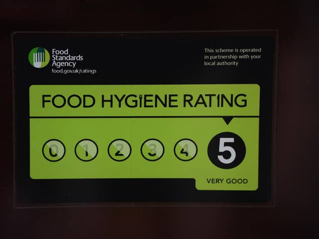 A Food Standards Agency rating sticker on a window of a restaurant in central London. A huge variation in food hygiene standards remains across the UK, with one in five high or medium-risk food outlets failing to meet standards, according to a study.