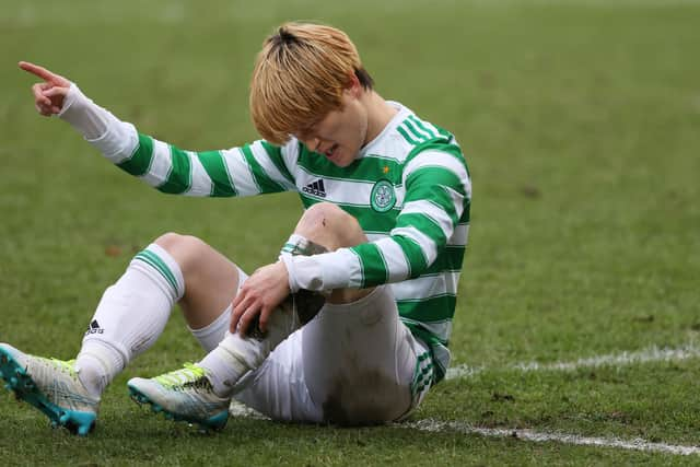 Celtic's Kyogo Furuhashi  shows his exasperation over the problem that forced off early into his team's 3-1 win away to St Johnstone. (Photo by Craig Williamson / SNS Group)