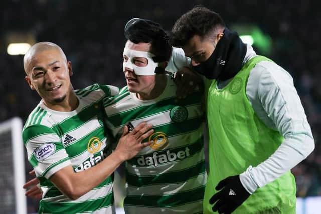Celtic's Callum McGregor (centre) celebrates with Daizen Maeda and Albian Ajeti after making it 2-0 during a Cinch Premiership match between Celtic and St Mirren.  (Photo by Craig Williamson / SNS Group)