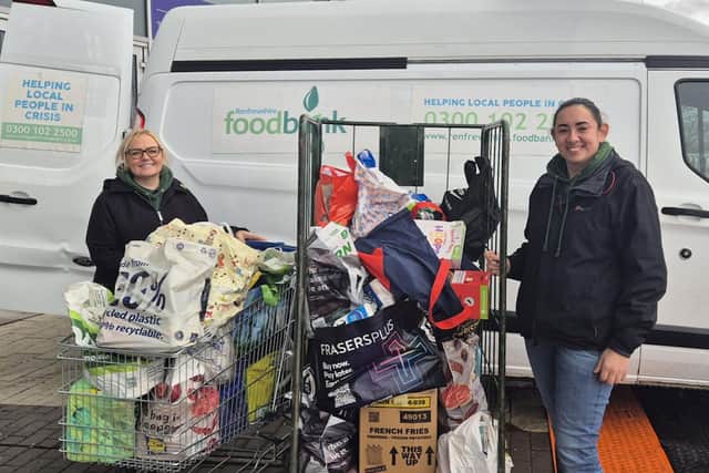 From left, Julie Edmiston and Crystal Clayton from Renfrewshire Foodbank collecting the donations made by Clan fans.