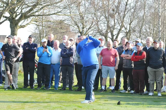 Watched by members, Carluke Golf Club captain John Cleland launches 2022 season by hitting opening tee shot