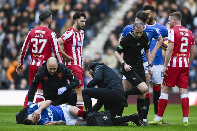 Referee Willie Collum surveys the scene before brandishing a red card to St Johnstone's Nicky Walsh for his tackle on Rangers midfielder Ryan Jack. (Photo by Rob Casey / SNS Group)