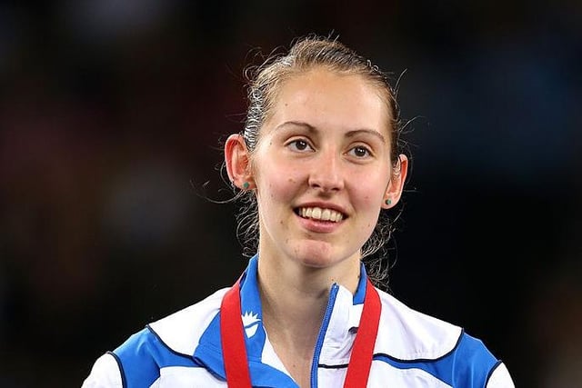 Silver medallist Kirsty Gilmour of Scotland receives her medal following the Women's Singles Gold Medal Match at Emirates Arena during day eleven of the Glasgow 2014 Commonwealth Games.