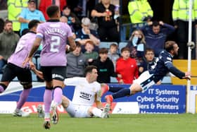 Jon McLaughlin fouls Paul McMullan and a penalty is awarded - but no red card.