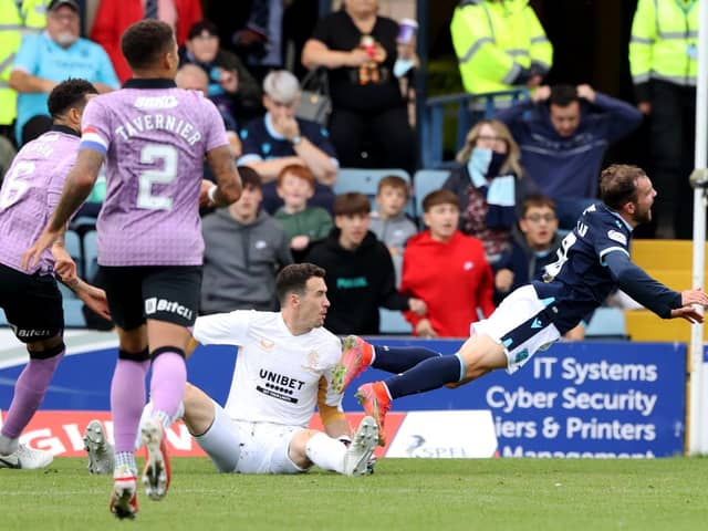 Jon McLaughlin fouls Paul McMullan and a penalty is awarded - but no red card.
